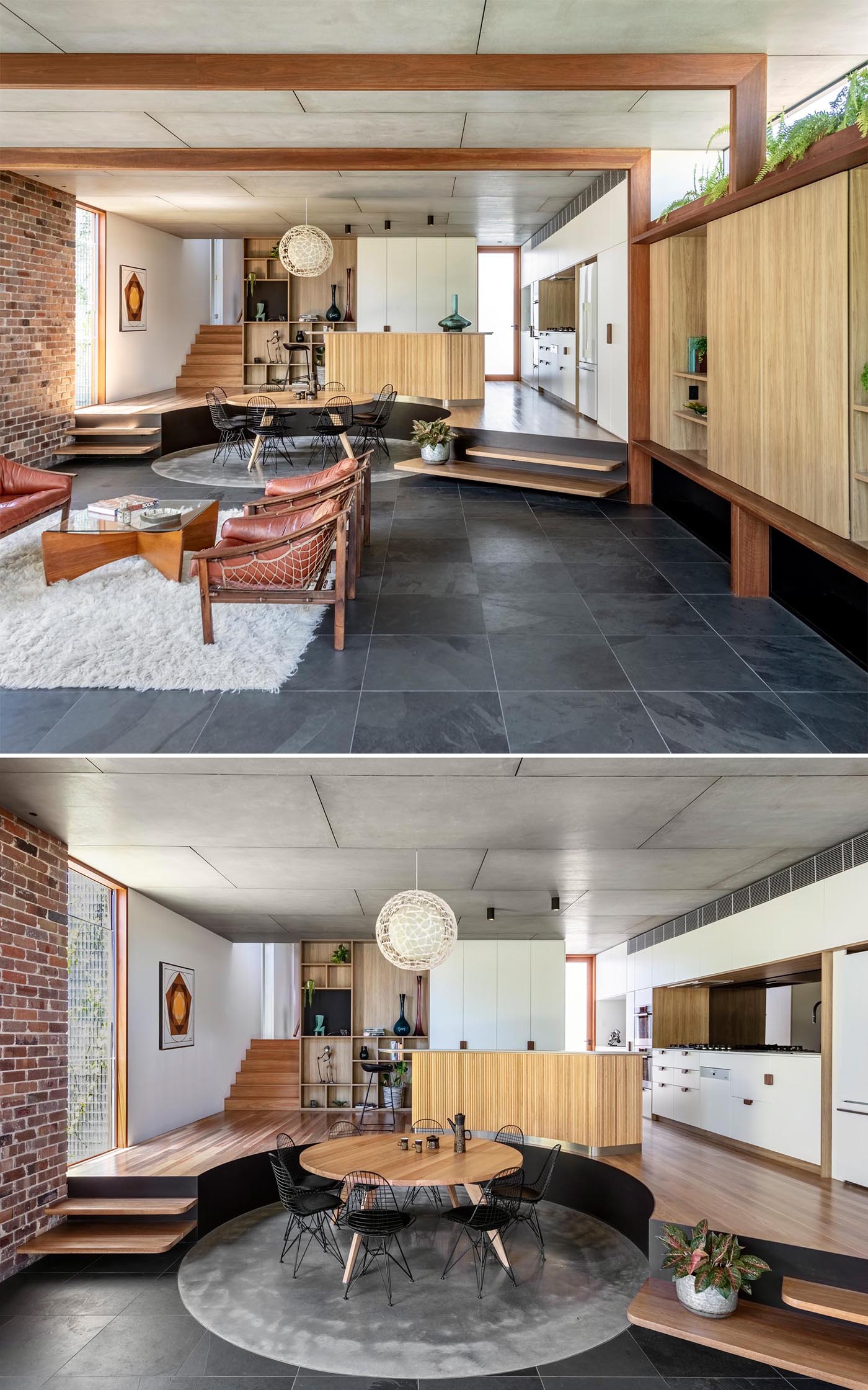 Behind the living room in this modern addition is the dining area, with a round wood table that sits upon a round rug.