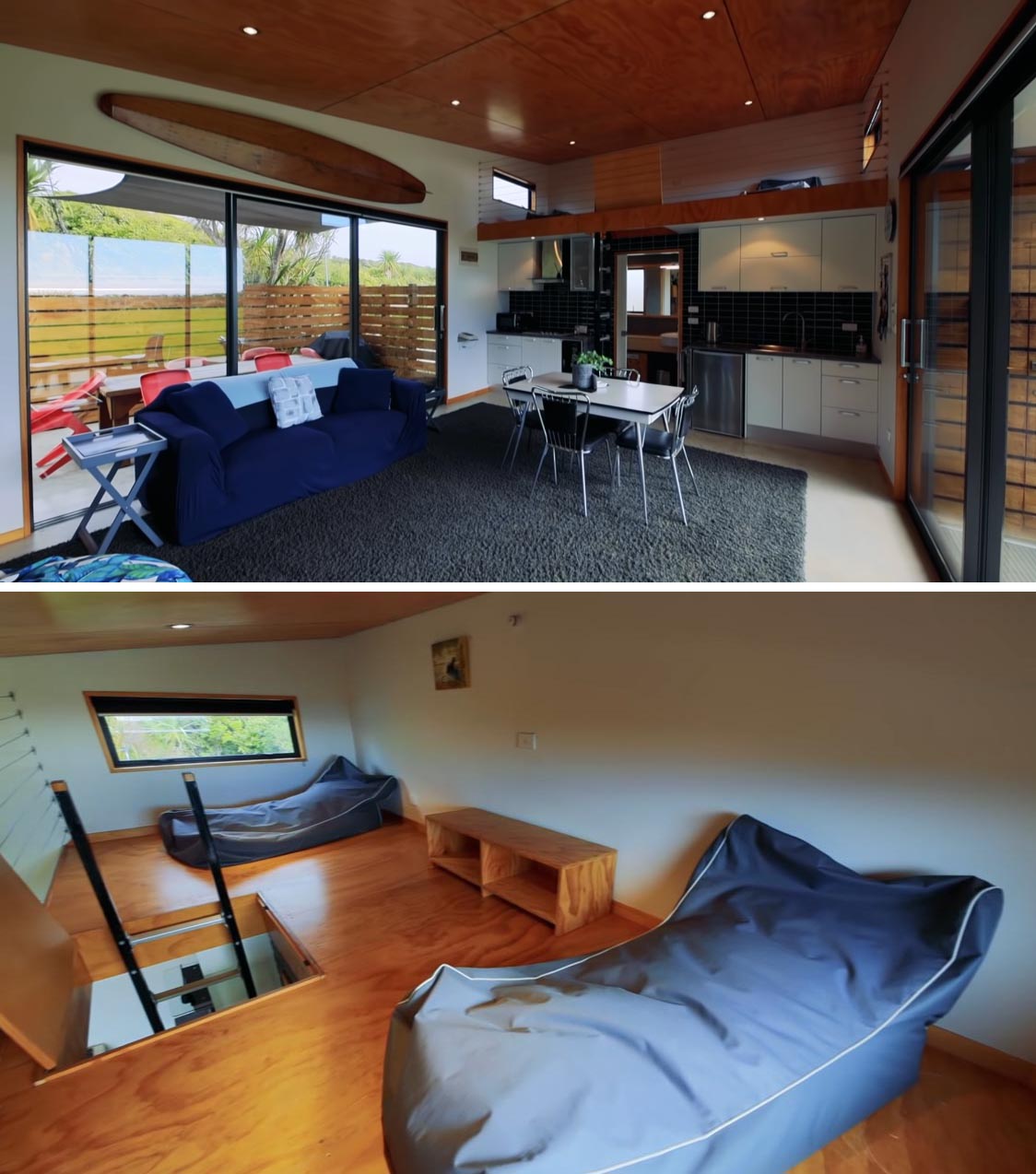 The black and white kitchen makes it easy to cook a meal in this modern tiny home, while above the kitchen and accessed via a ladder, is a lofted seating area.