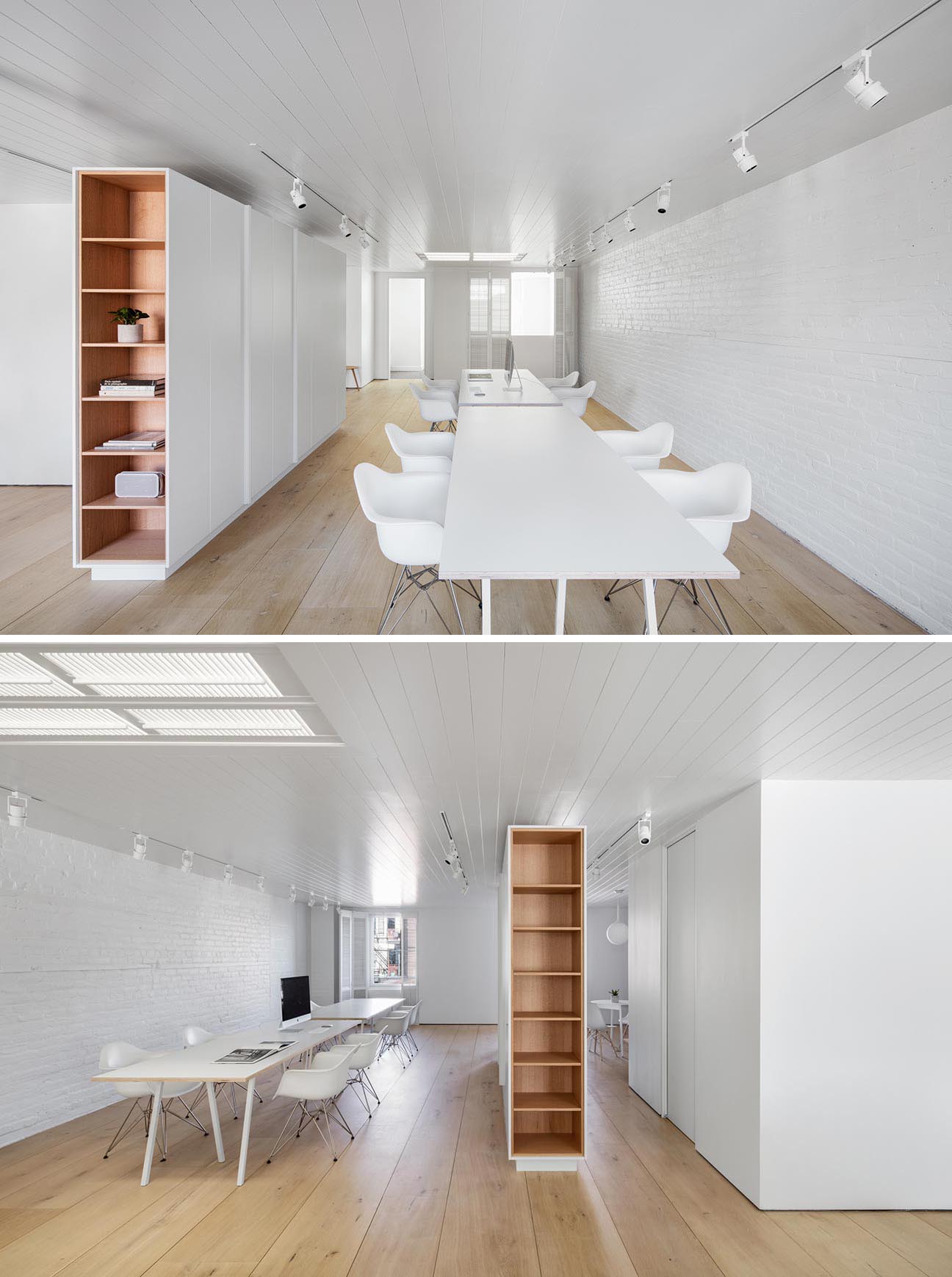 A modern office with wood lined shelves and wood floors.