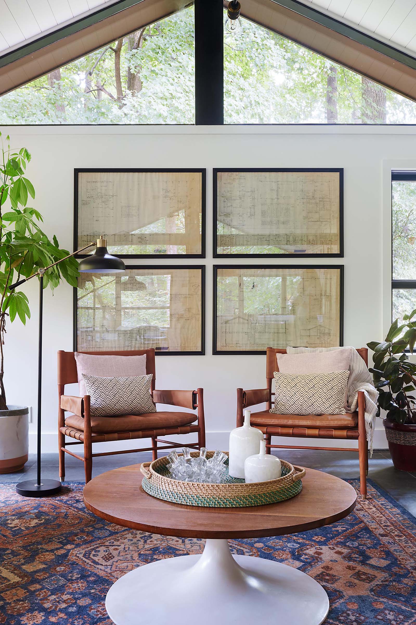 A modern living room with black framed art.