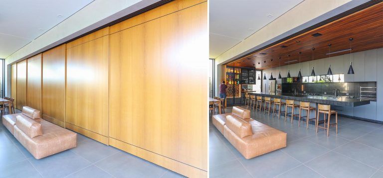 A Long Sliding Wood Wall Hides This Kitchen From View