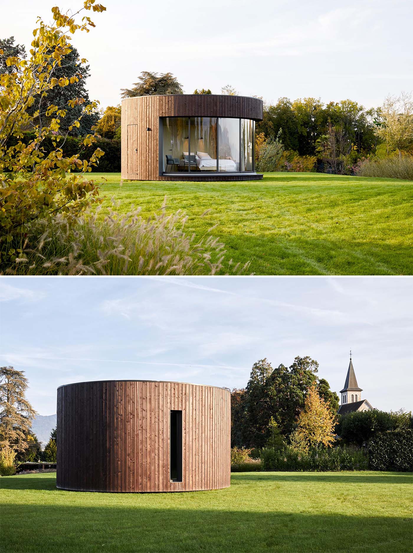 A small round cabin includes an exterior of vertical dark wood siding.