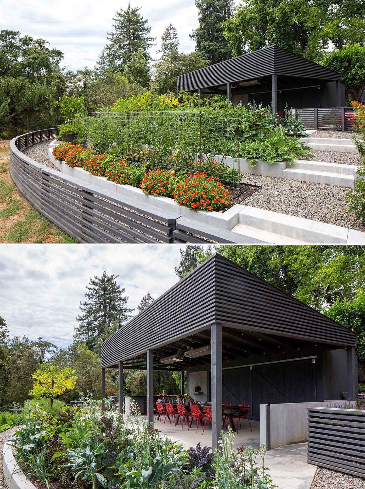 A modern garden with an covered outdoor dining area and terraced built-in planters made from concrete.