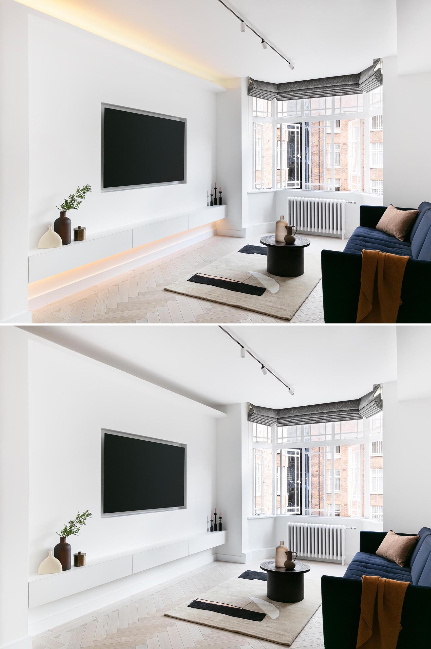 To create the bright spaces and clean lines, the designers went with crisp white walls and added in LED lighting to highlight the straight edges, like in the living room, also also includes a recessed television and floating storage cabinet.