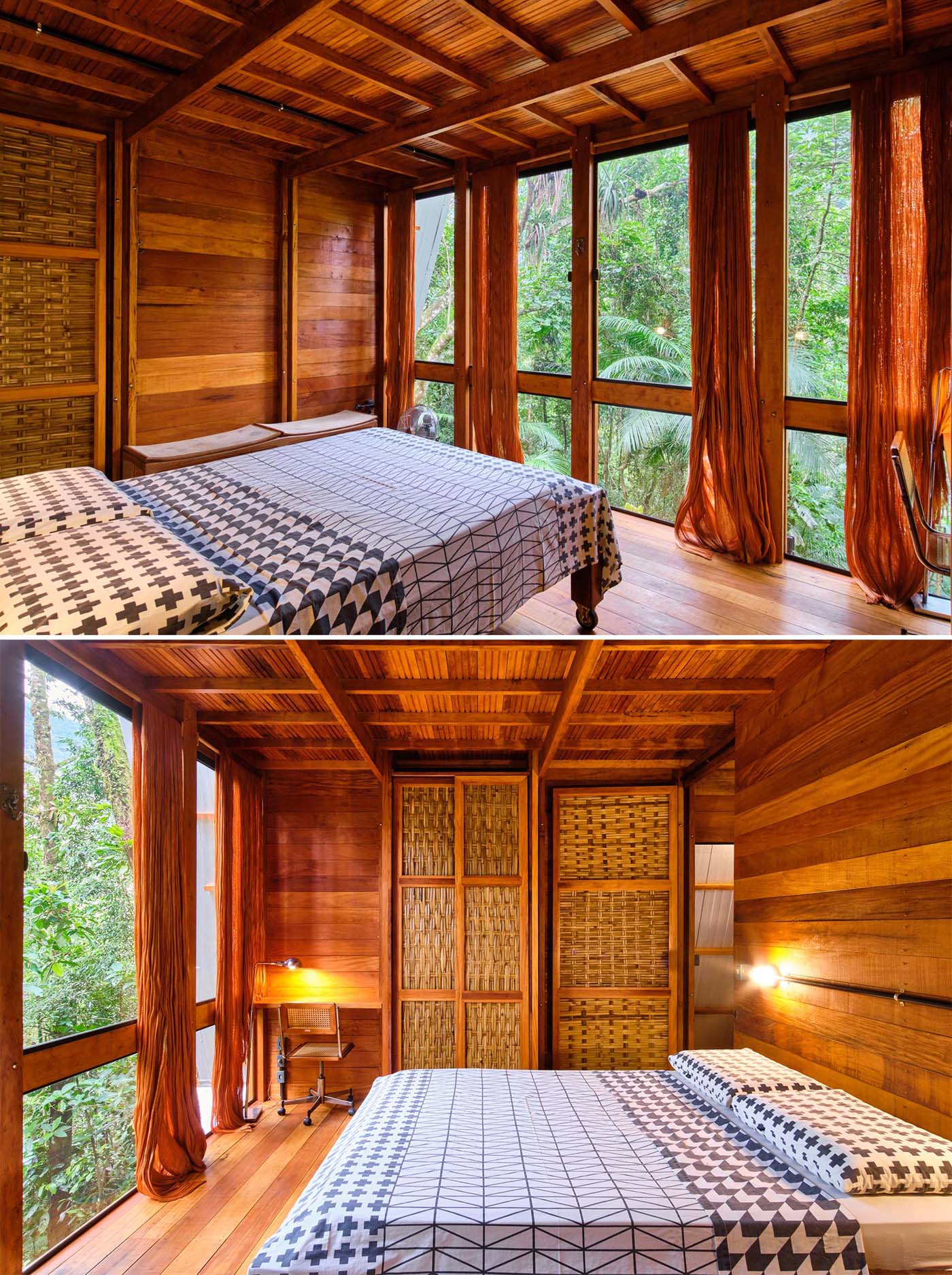 The bedroom of an A-frame cabin with a warm wood interior and floor-to-ceiling windows.