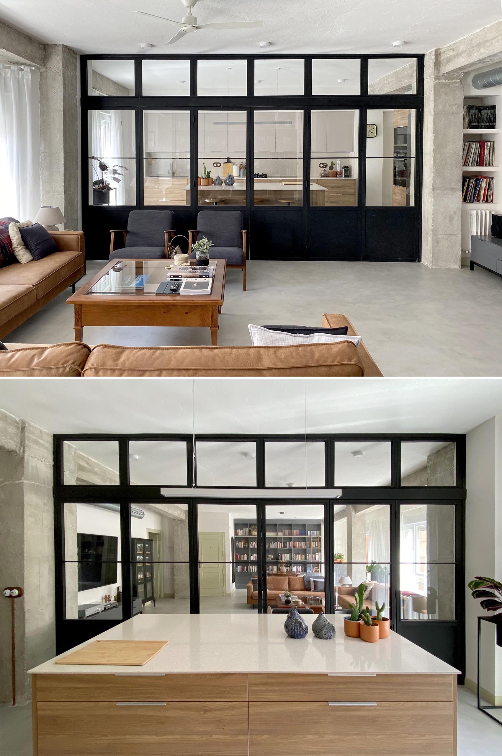 A modern kitchen can be closed off from the living room by black-framed doors with windows.