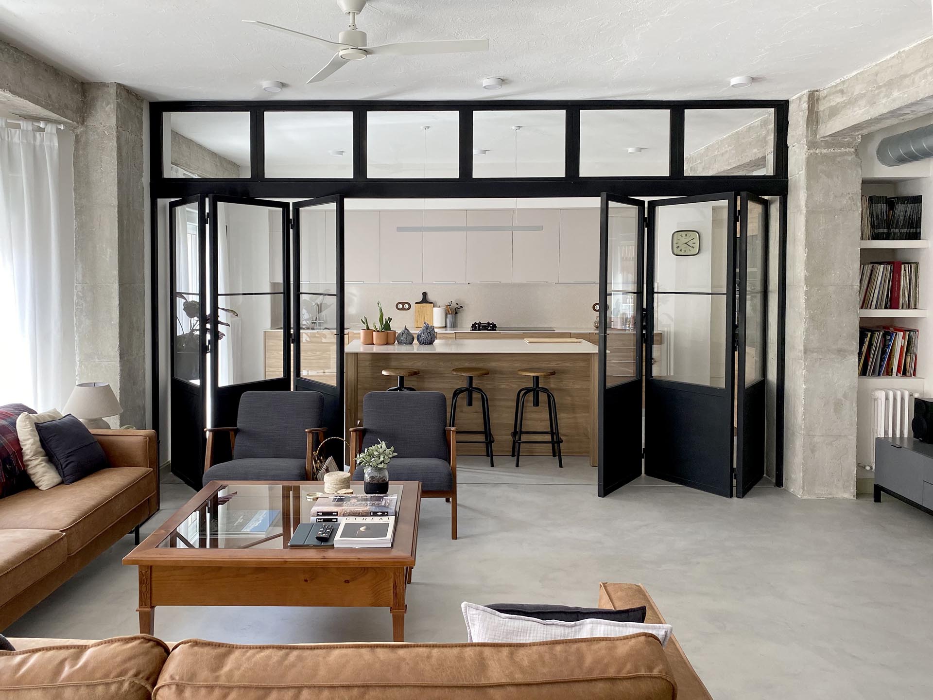 Black Framed Doors With Windows Enclose The Kitchen But Not The Natural Light