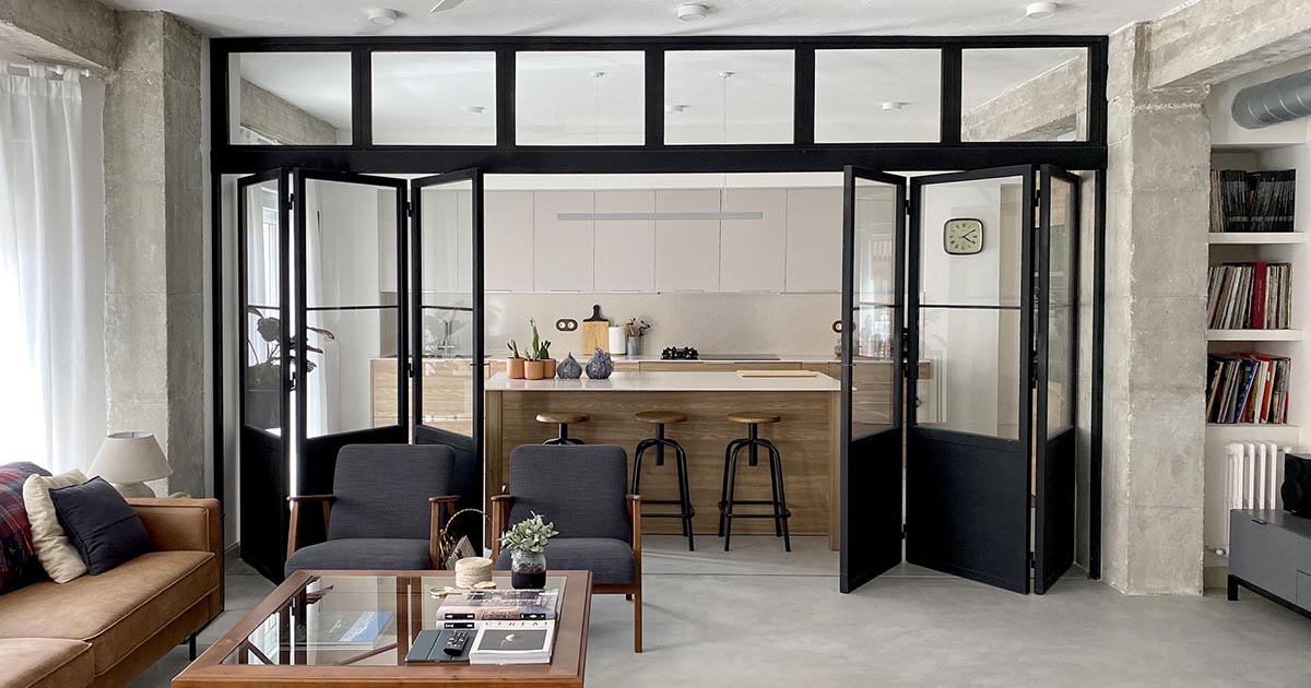 Black-Framed Doors With Windows Enclose The Kitchen But Not The Natural ...