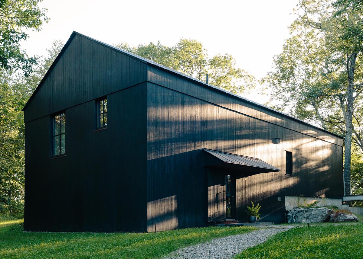 A large cabin-style home with charred cedar siding.