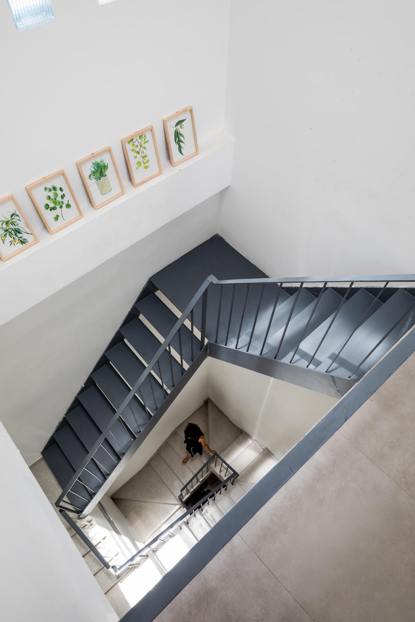 A modern home with black steel stairs.