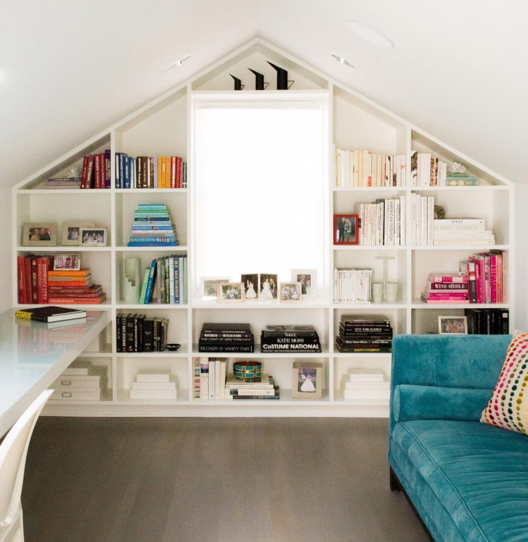 A Symmetrical Bookshelf Designed To Fill The Wall Around A Window Completes One End Of This Home Office