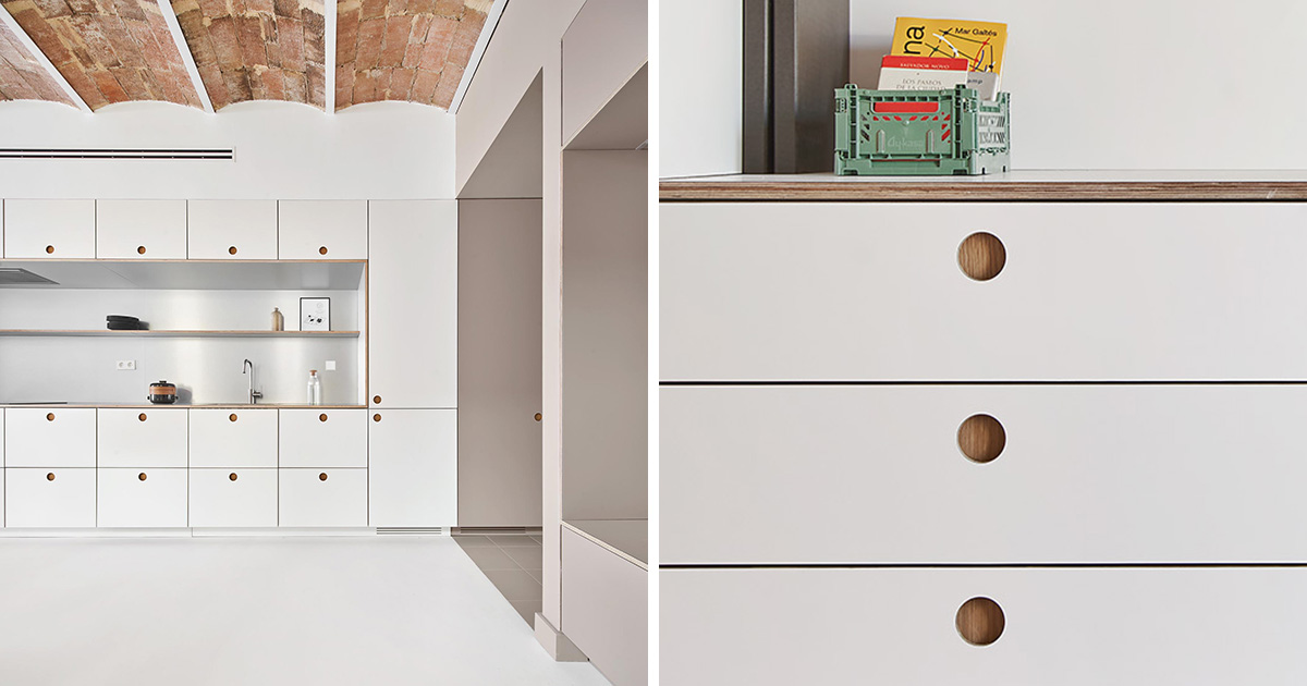Minimalist kitchen cabinets and drawers with recessed finger pulls.