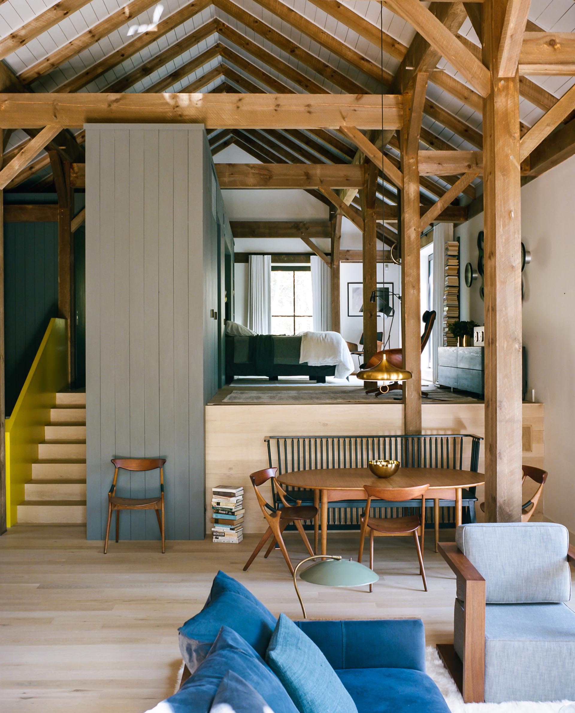 The multi-level interior of a barn-inspired home.