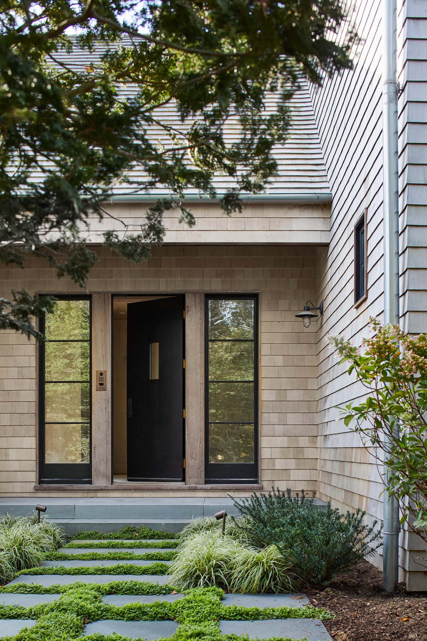 Welcoming visitors to this home is a custom designed front door crafted by a local mill worker. 