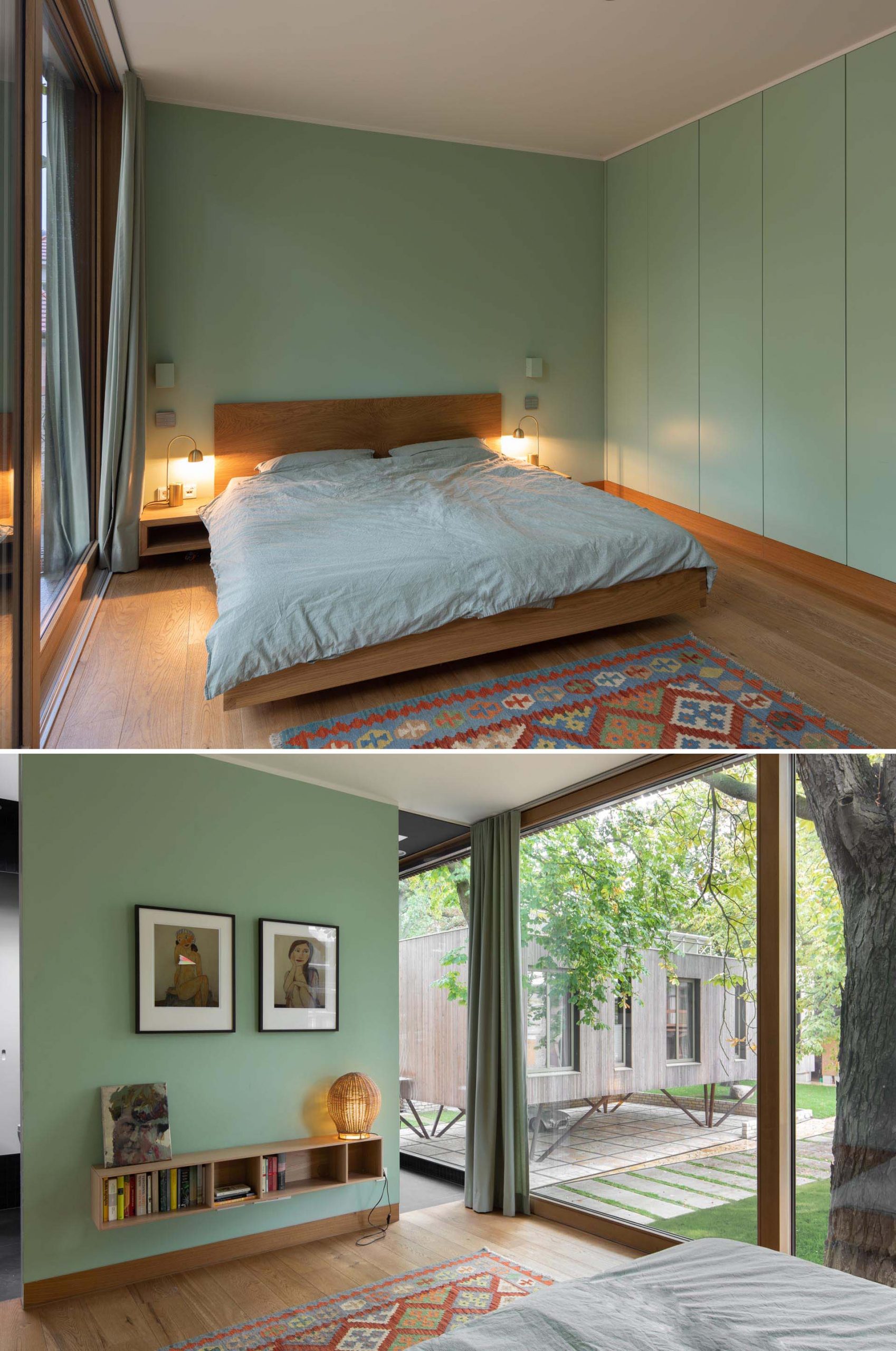 A modern bedroom with light green walls, wood flooring, and wood bed frame.
