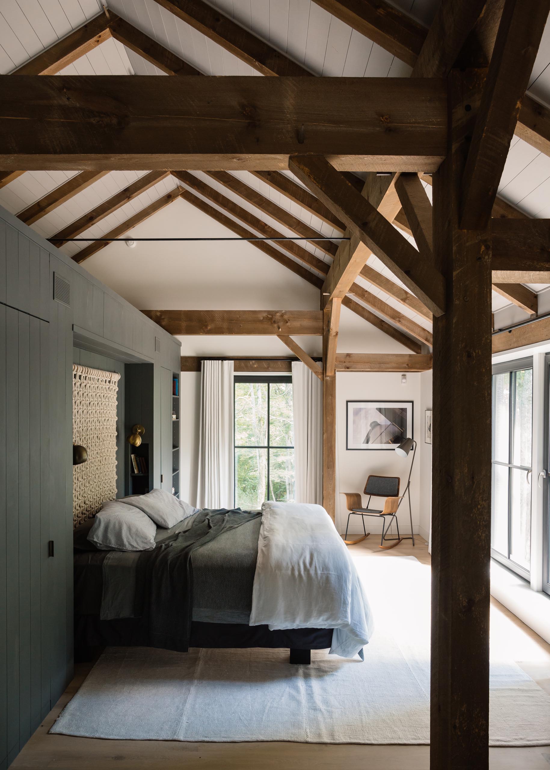 A modern barn-inspired bedroom with exposed wood.