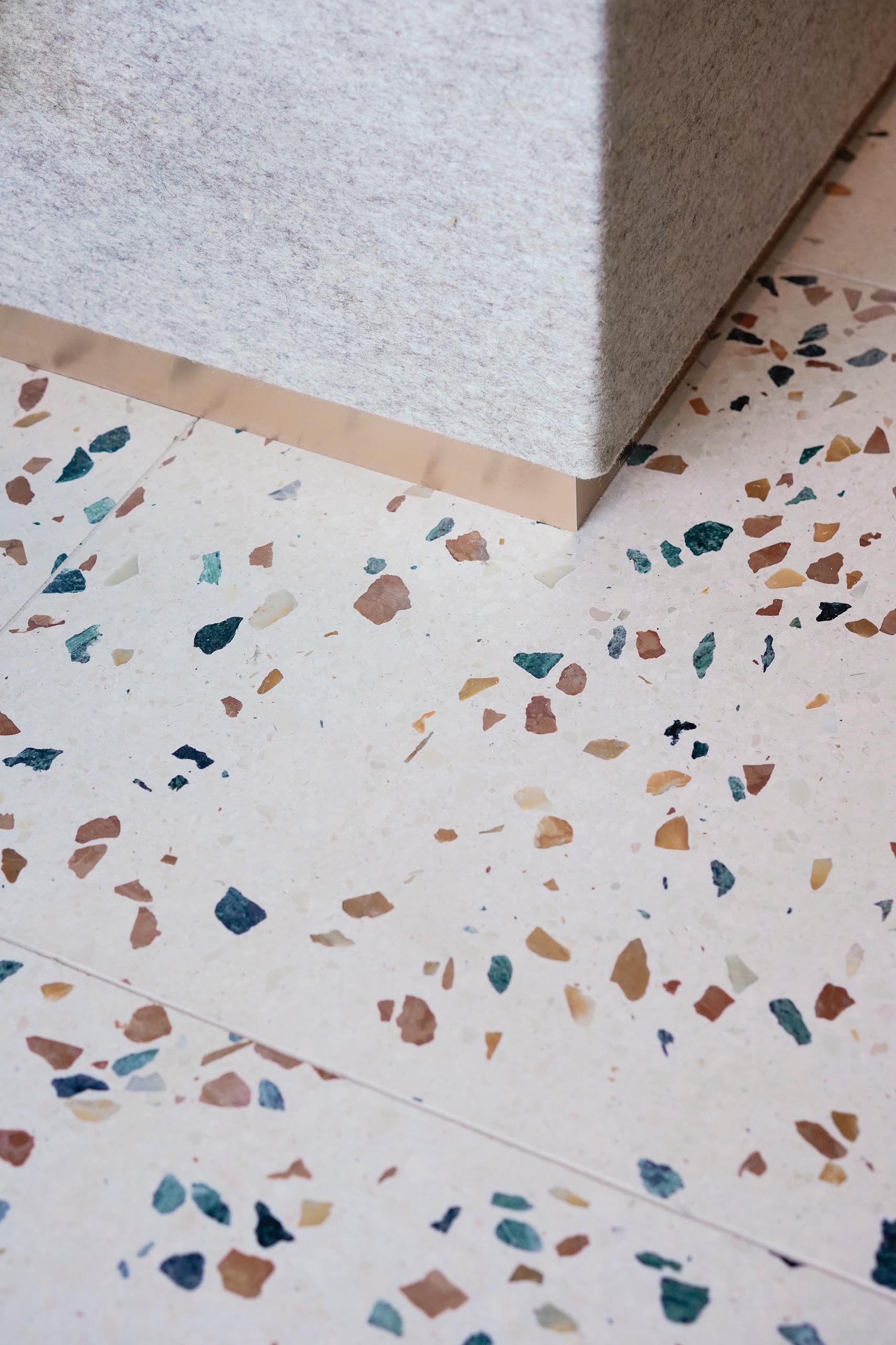 A modern interior with colorful terrazzo tile floors.