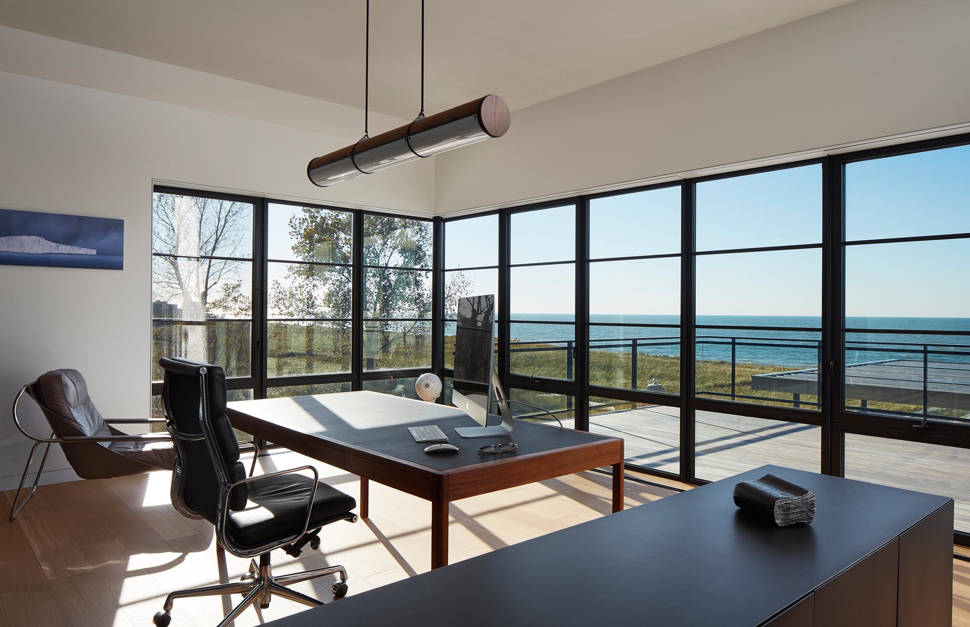 This home office is minimalist in its design, with a desk perfectly positioned for taking advantage of the views.