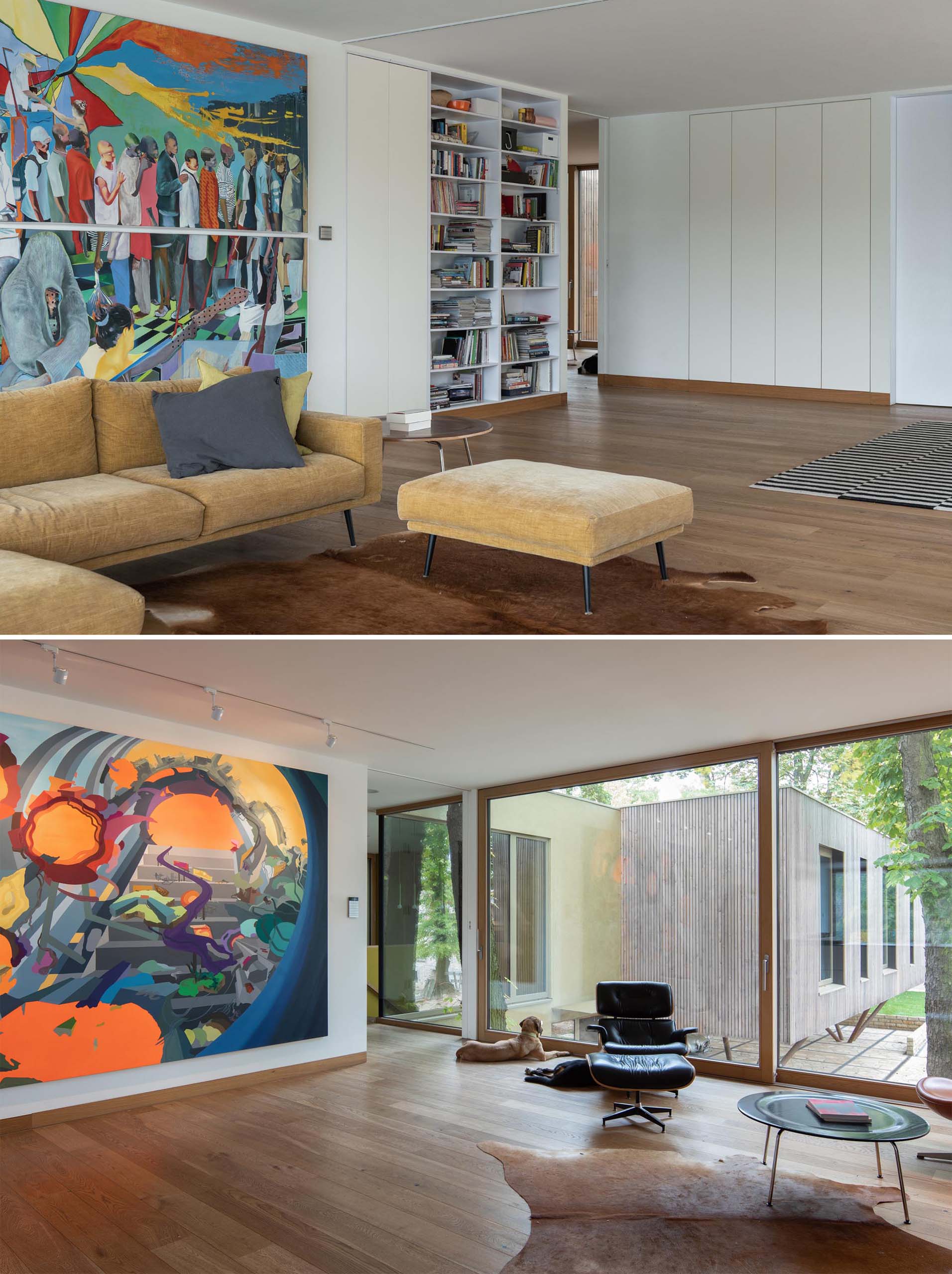 A modern living room with large and colorful artwork.