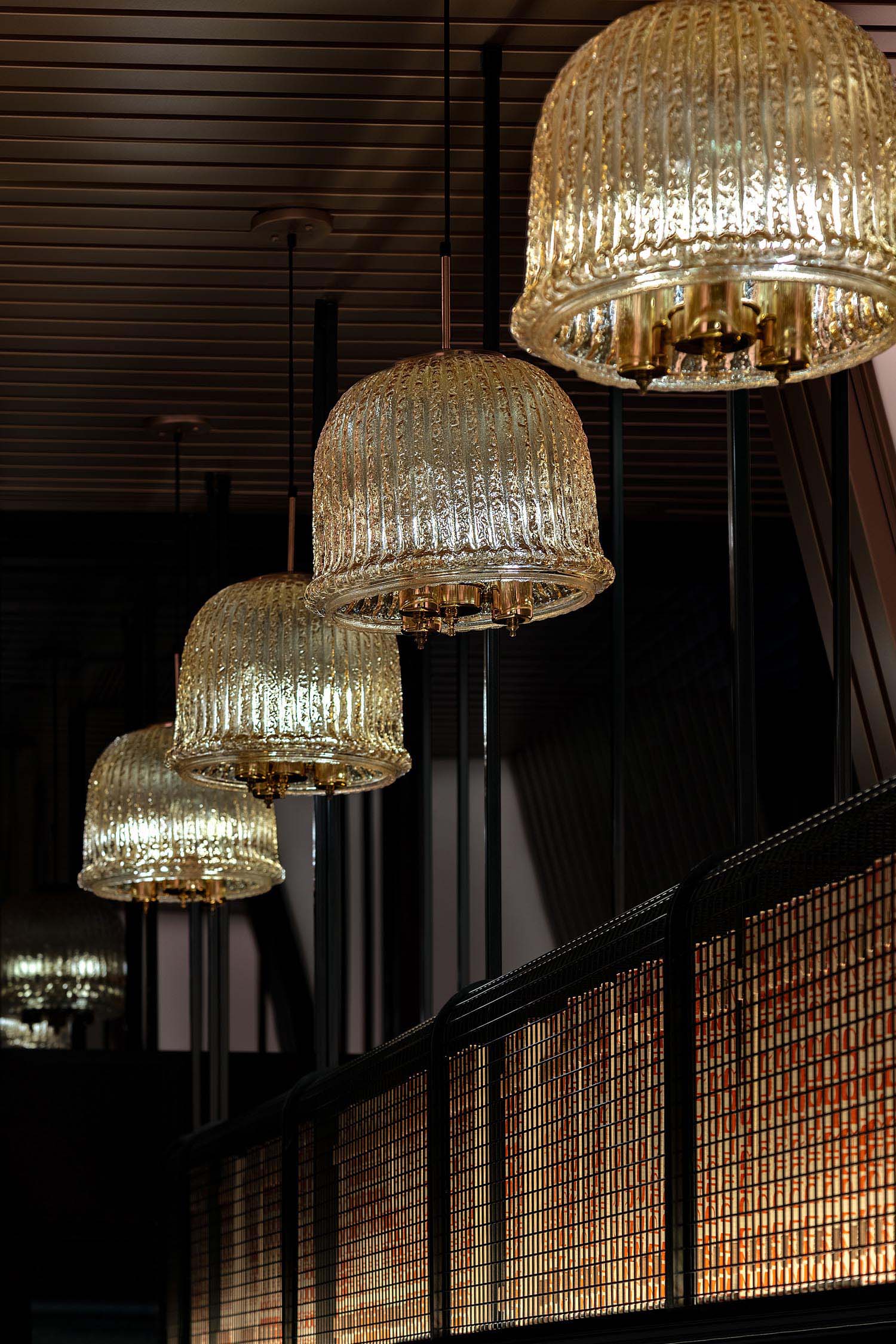 Glass pendant lights featured in a restaurant.