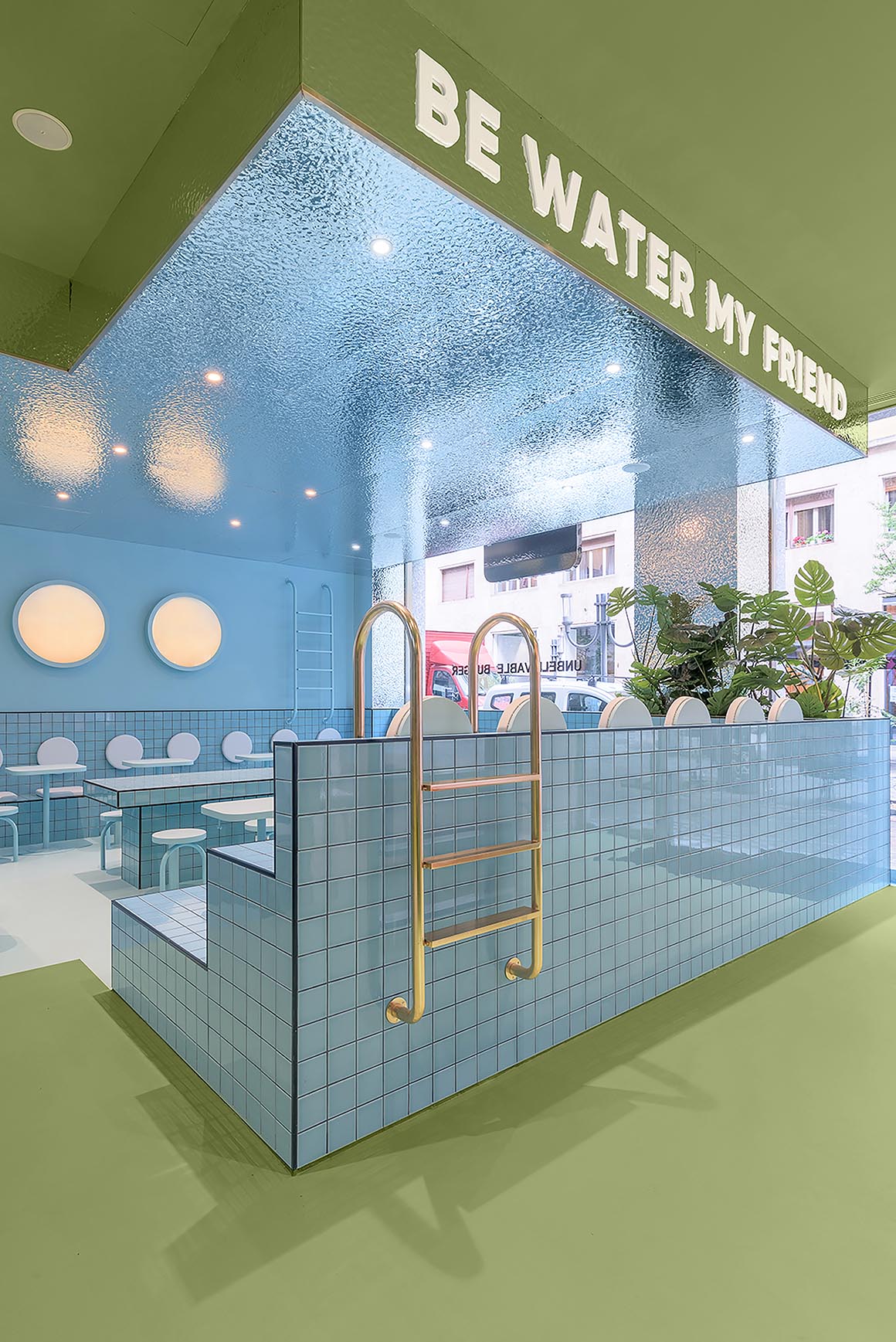 A modern restaurant interior with blue section inspired by a swimming pool.