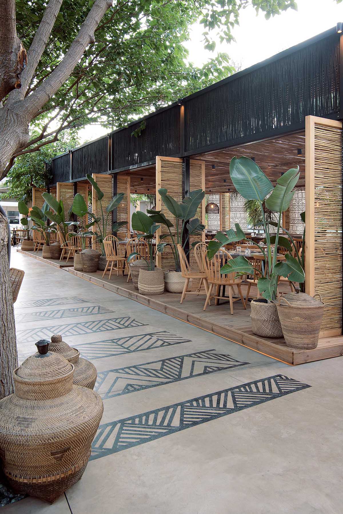 This restaurant and bar has a beach aesthetic that was created with reed screens, lighting, and decor.