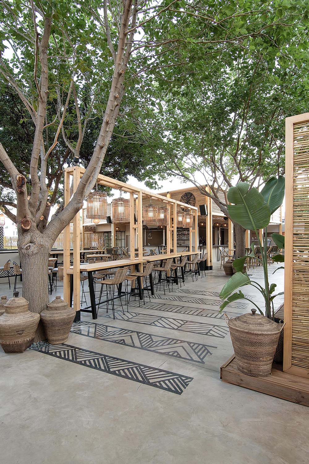 This restaurant and bar has a beach aesthetic that was created with reed screens, lighting, and decor.