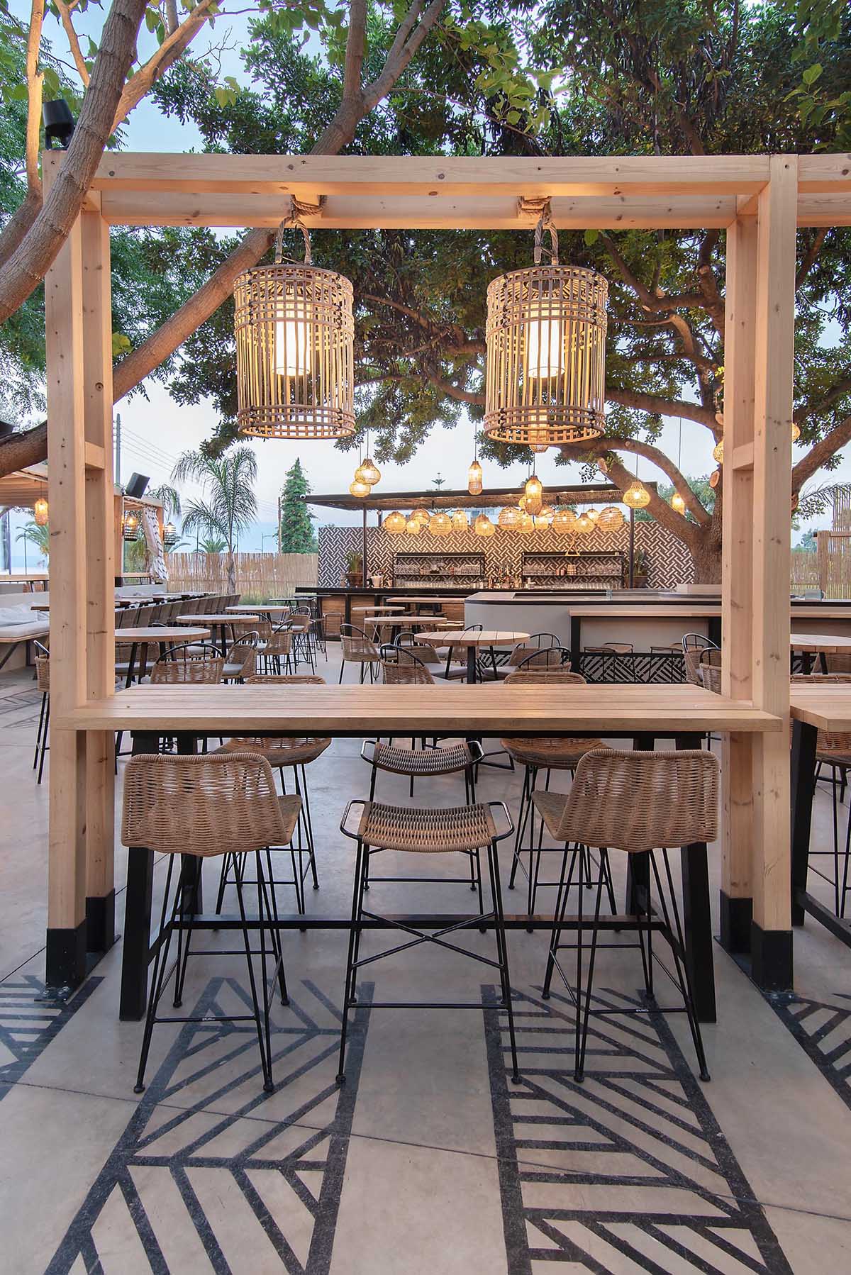 This restaurant and bar has a beach aesthetic that was created with reed screens, lighting, and decor.