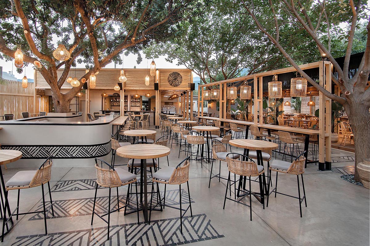 This restaurant and bar has a beach aesthetic that was created with reed screens, lighting, and decor.