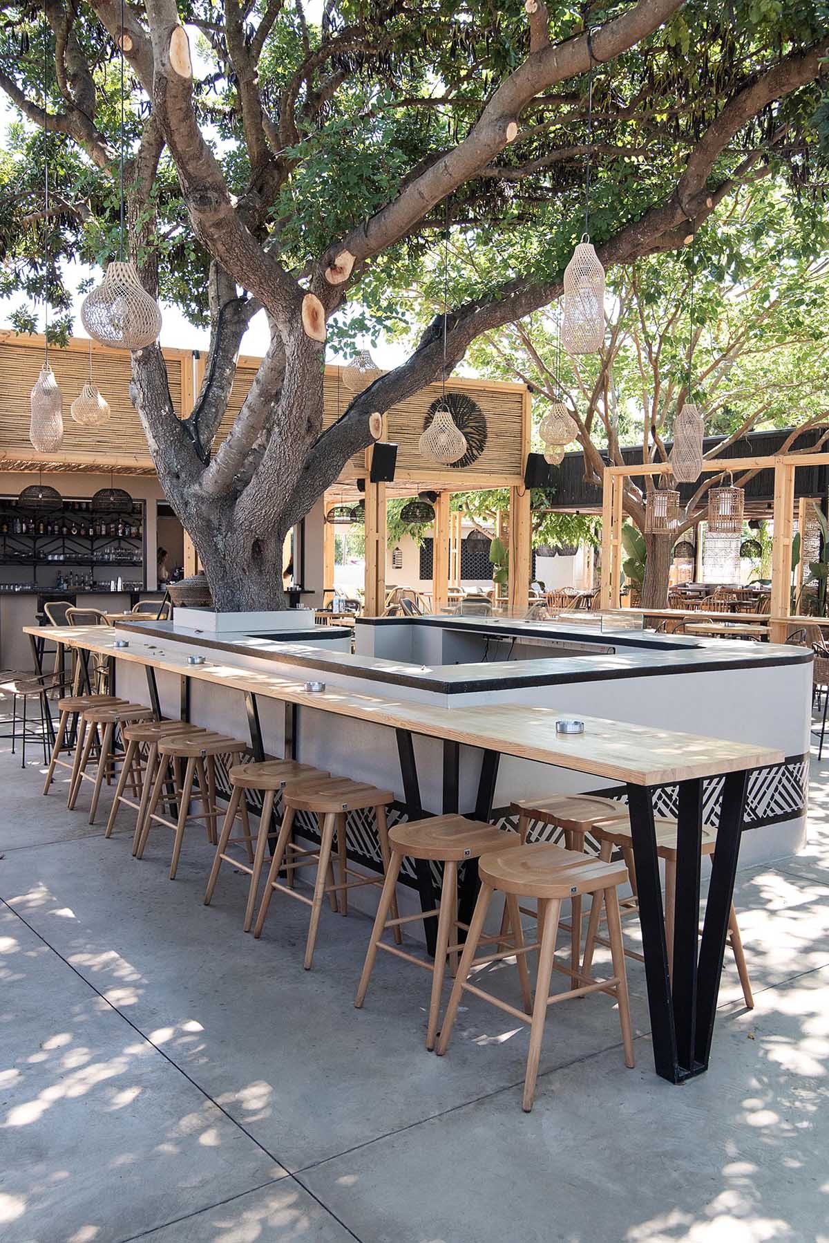 This restaurant and bar has a beach aesthetic that was created with reed screens, lighting, and decor.