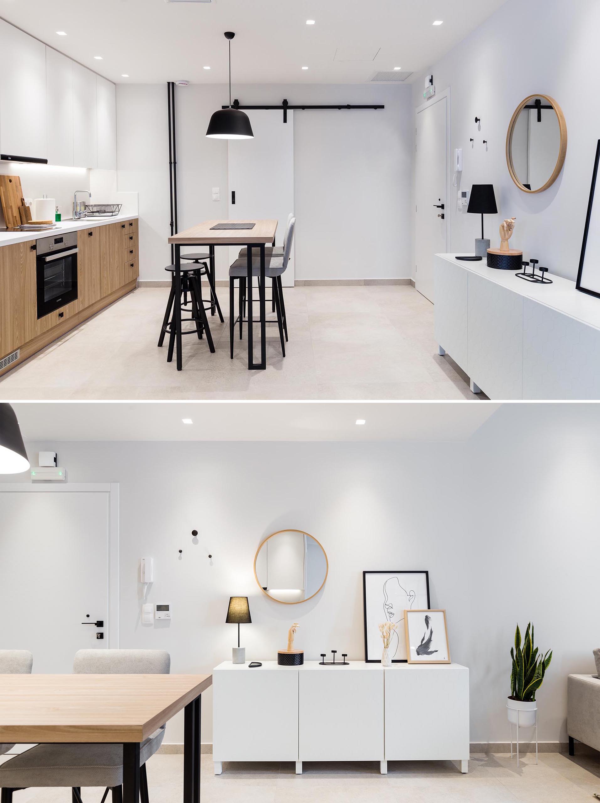 This small and modern apartment has the front door opening directly into the dining area and kitchen. A white sideboard creates added storage for the small apartment.