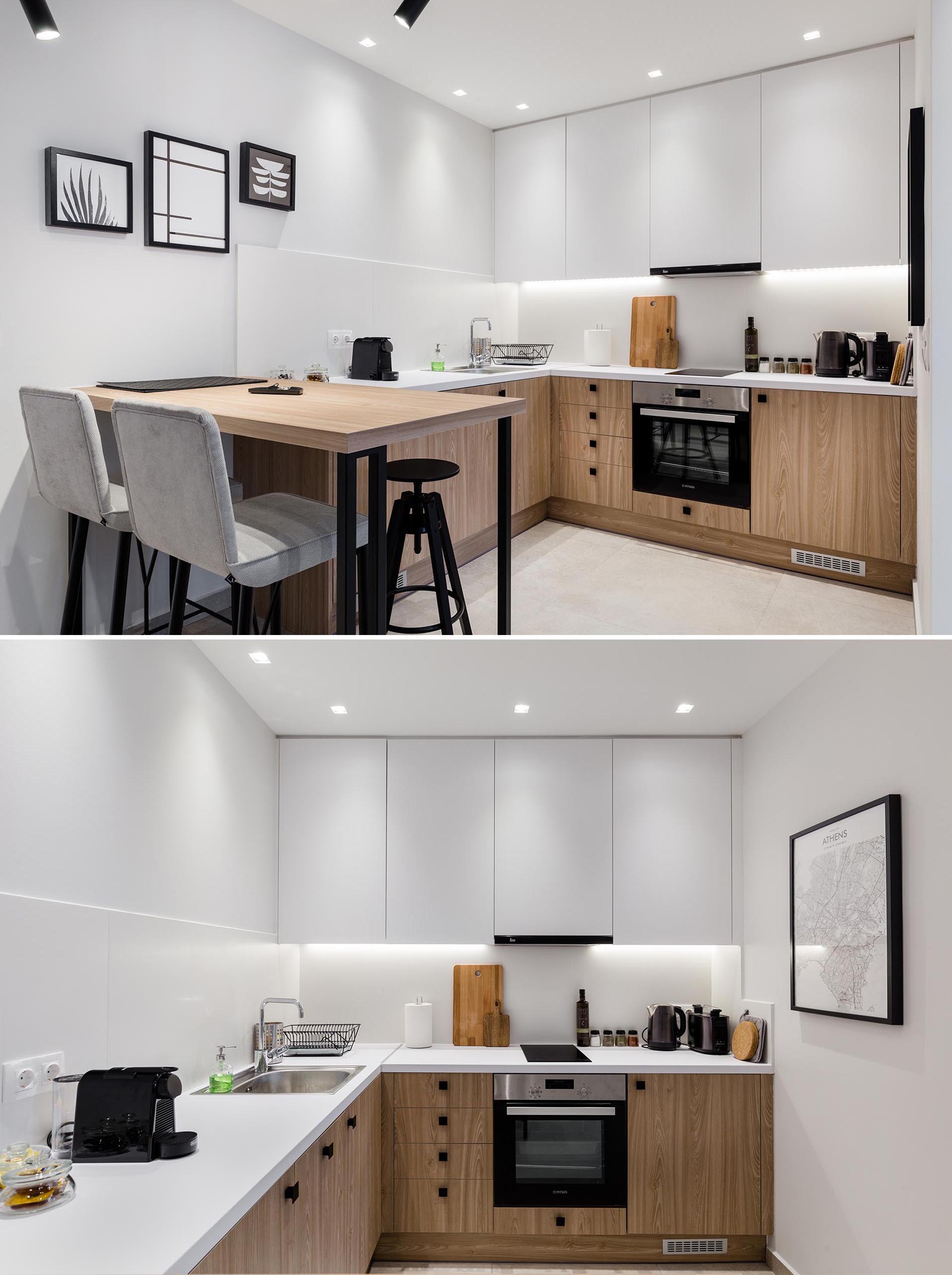 This small apartment has an open interior with a kitchen that features minimalist white upper cabinets and wood lower cabinets, as well as a bar height table.