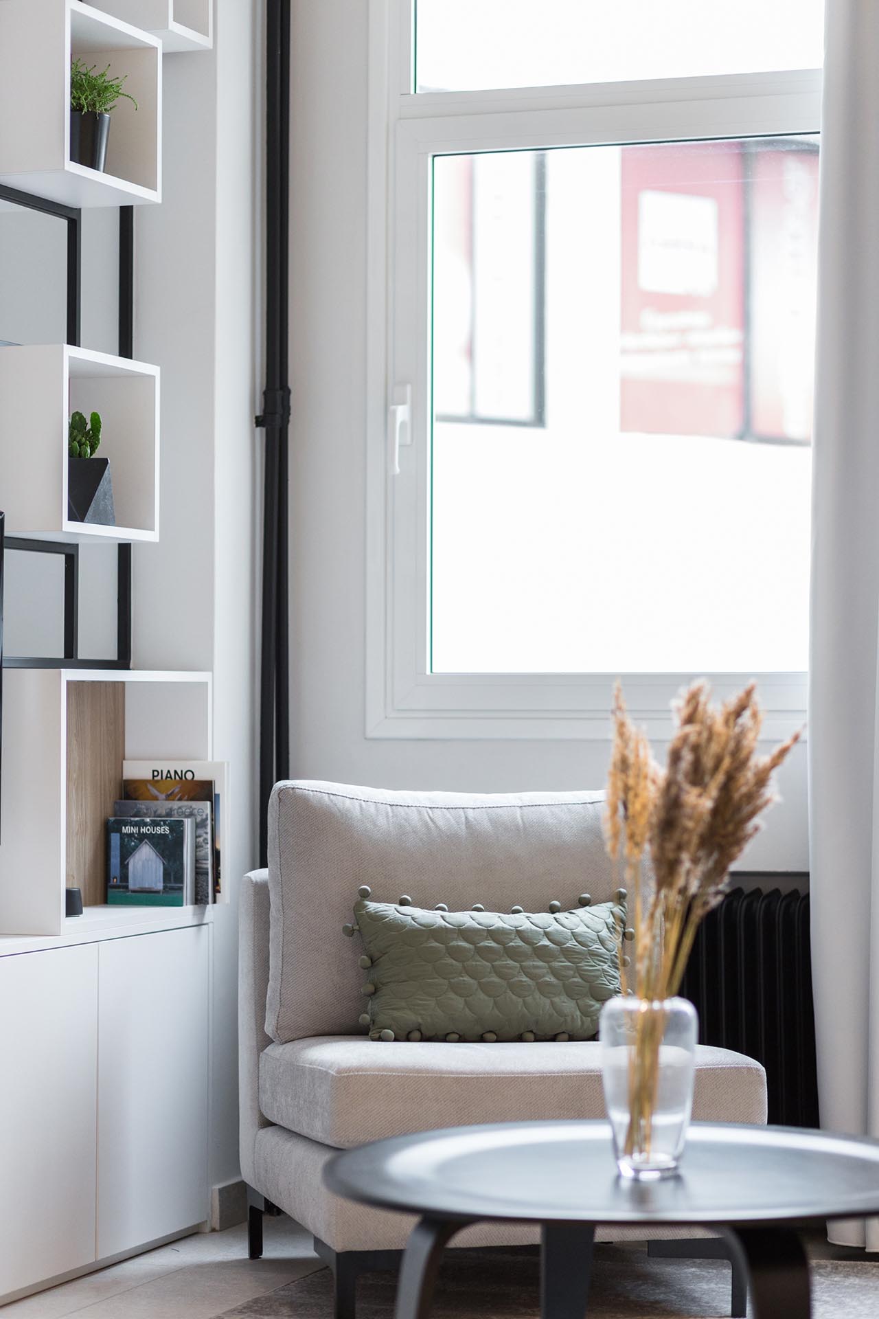 A modern living room with simple furnishings.