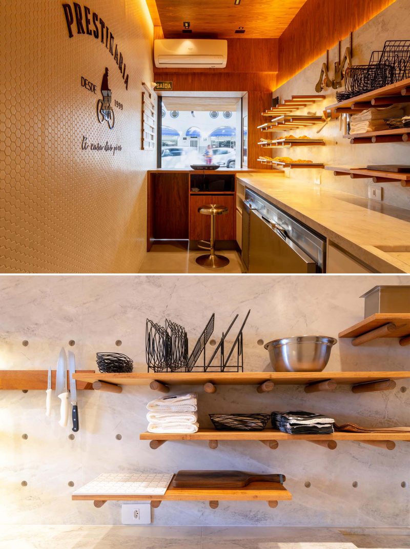 A small bakery makes use of wood dowels with hidden LED lighting to hold up shelving.