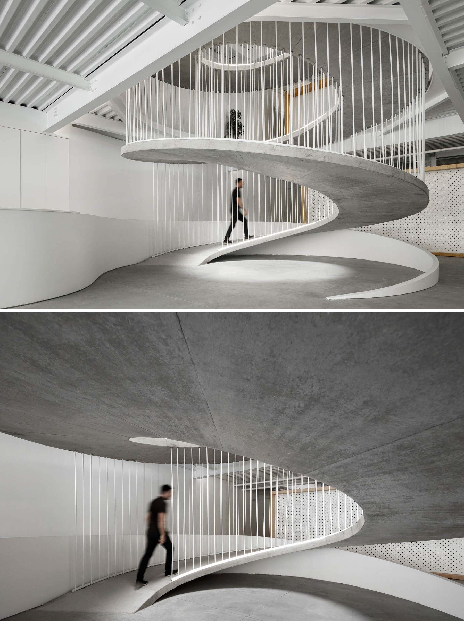 A spiraling ramp replaces the need for stairs in this modern office and adds a sculptural element.