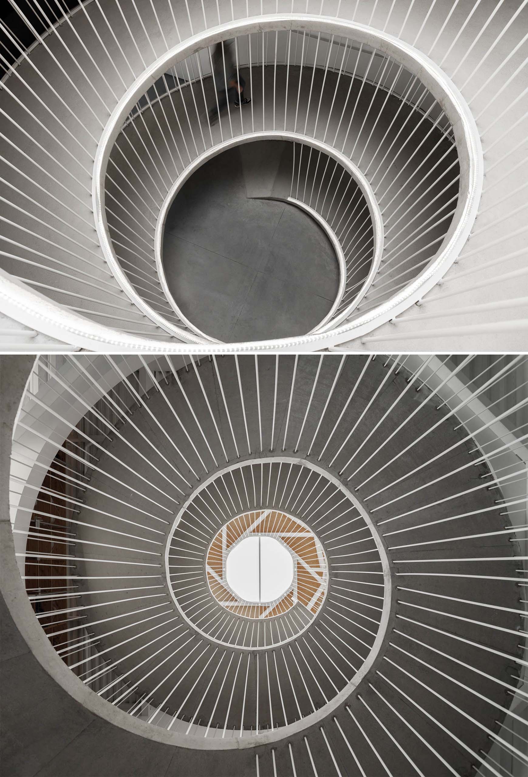 A spiraling ramp replaces the need for stairs in this modern office.