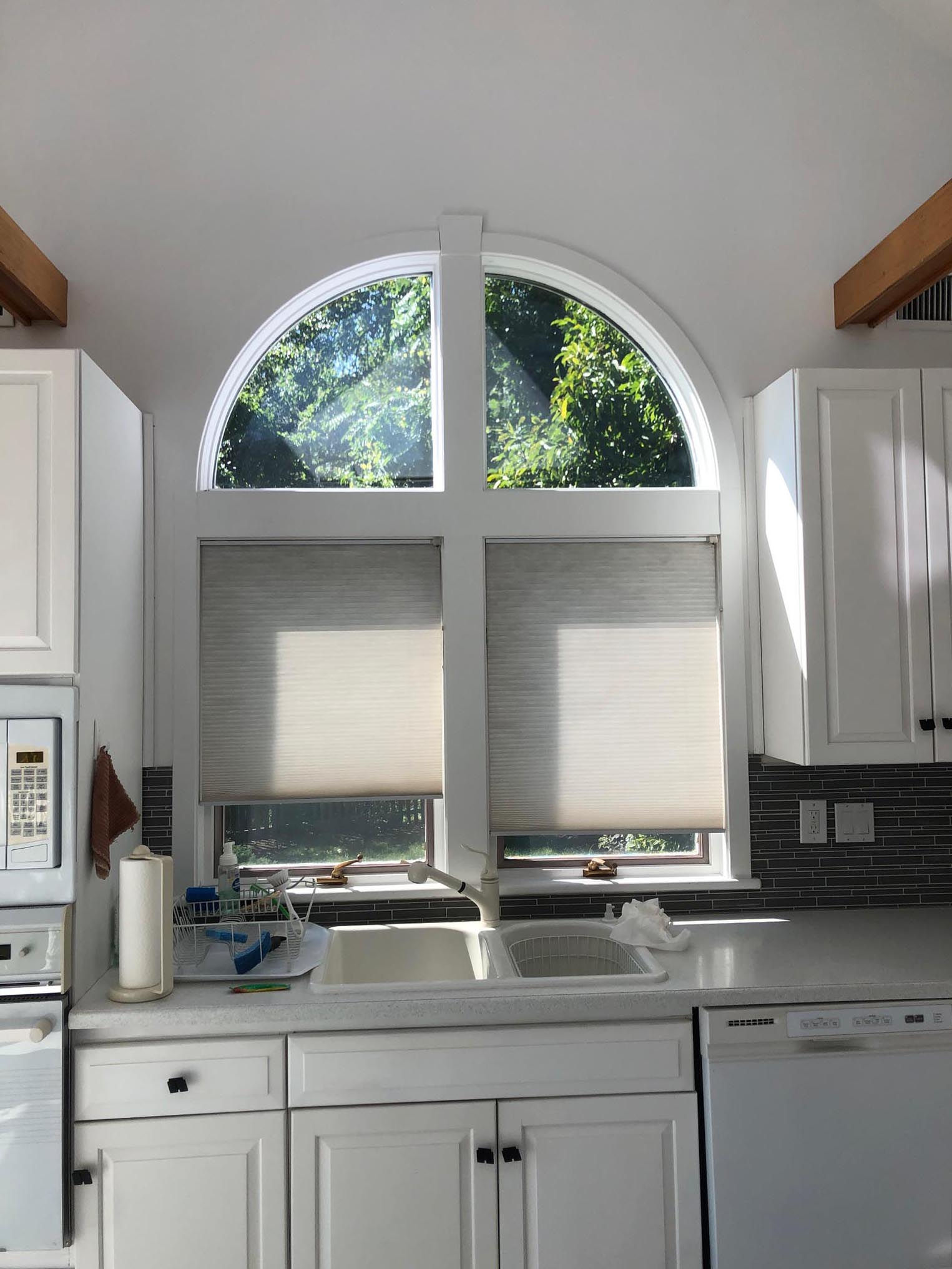 This original 1980s kitchen was outdated with old appliances and an uniquely shaped island. It was remodeled and transformed into a contemporary kitchen.