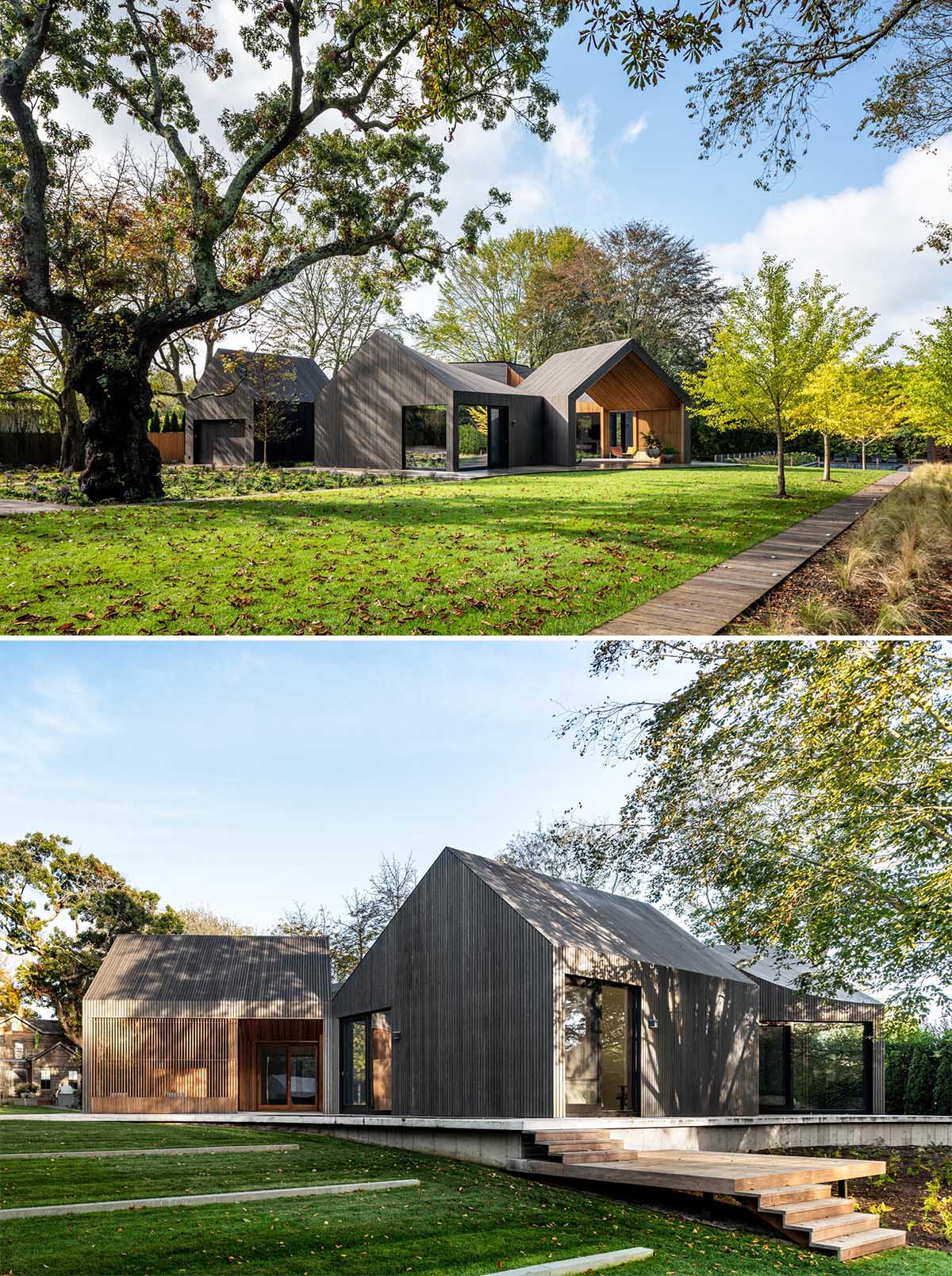 A modern house with six modules, is clad in charred, stained, and sealed accoya wood siding.