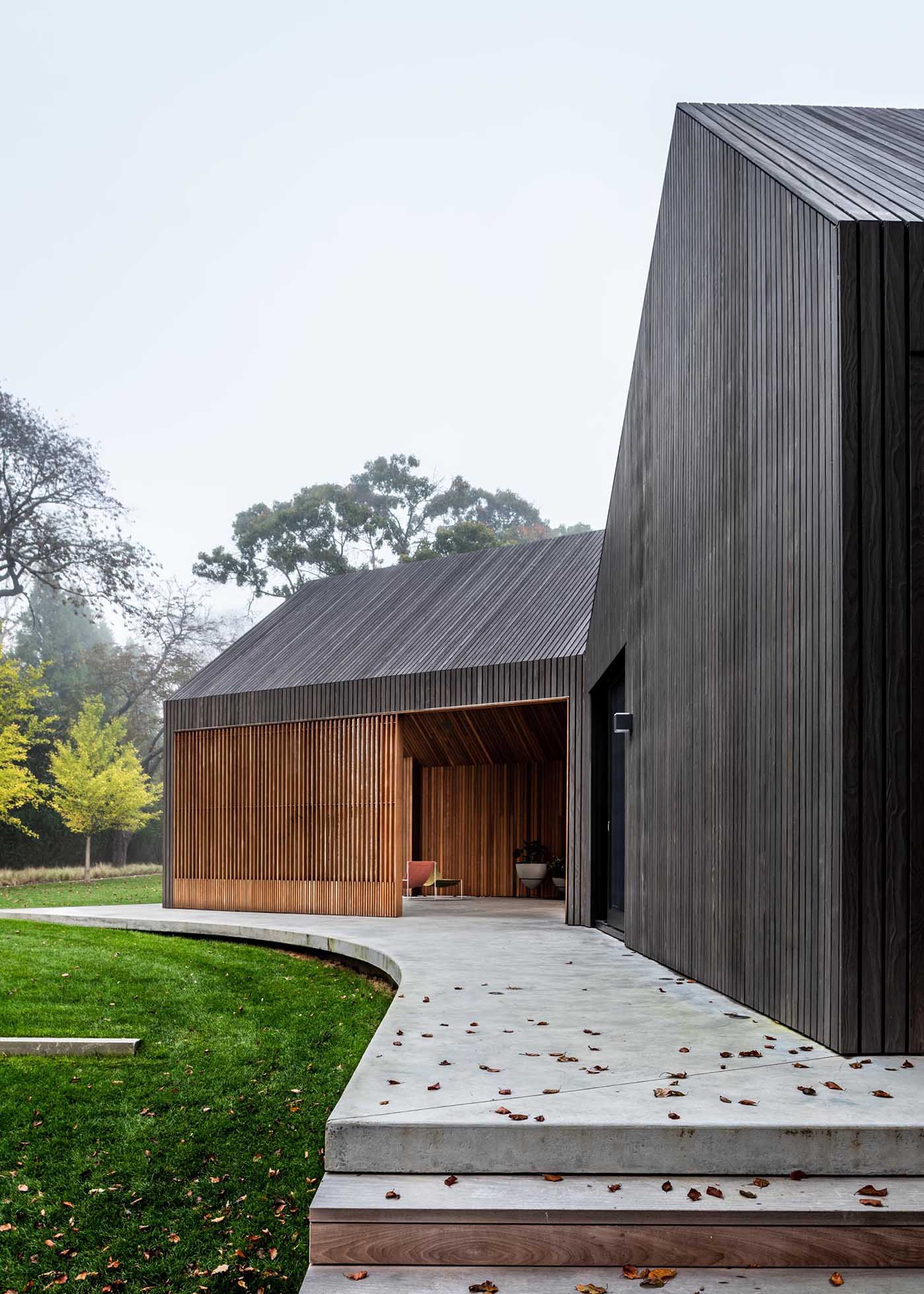 A modern house clad in charred, stained, and sealed accoya wood siding.