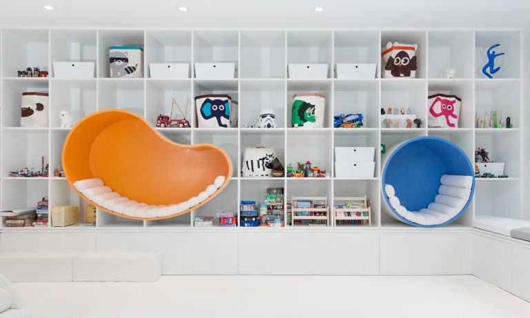 Seating Nooks Were Built Into A Wall Of Shelving In This Kid's Playroom