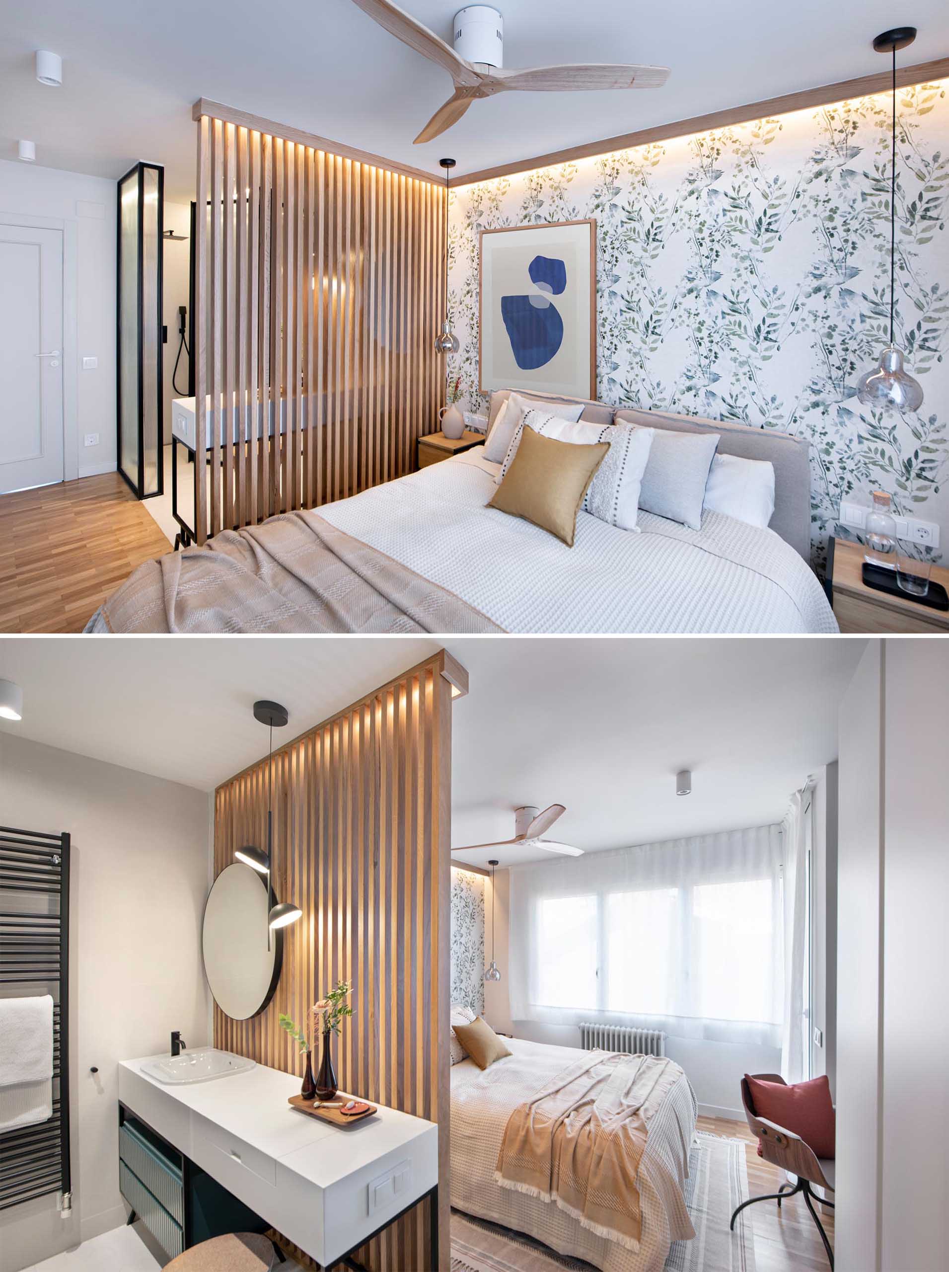 A modern primary bedroom and en-suite bathroom. Botanical wallpaper creates a feature wall, while the wood slat accent wall provides separation between the sleeping area and the bathroom.