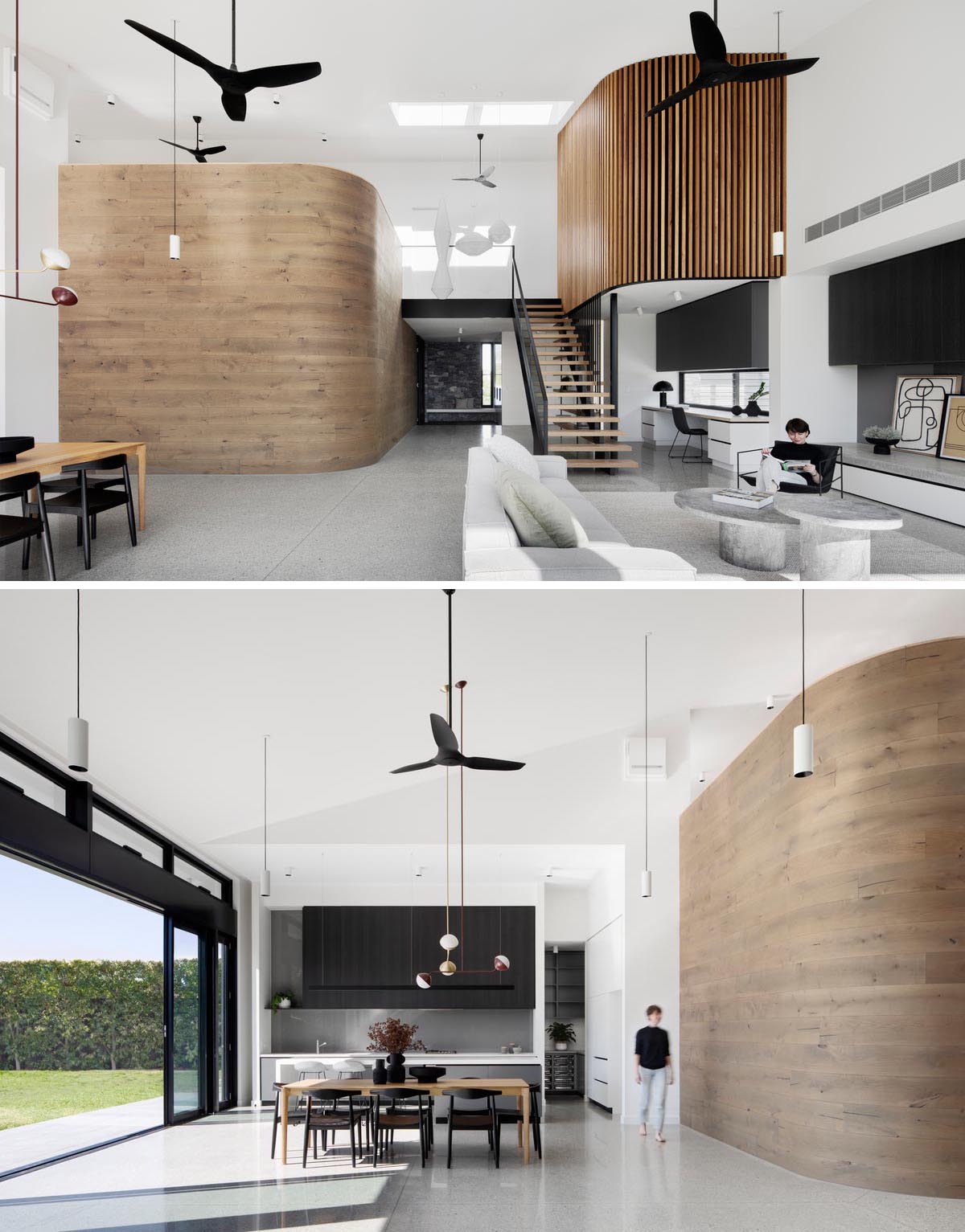 A modern interior with a curved timber wall and a second wood wall clad in timer battens.