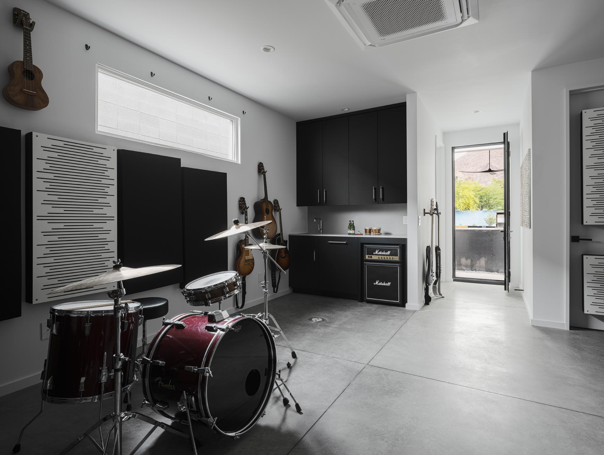 A detached 500 square foot music studio provides a place to play and record music, and there's a hidden roof deck on top for views of the valley.