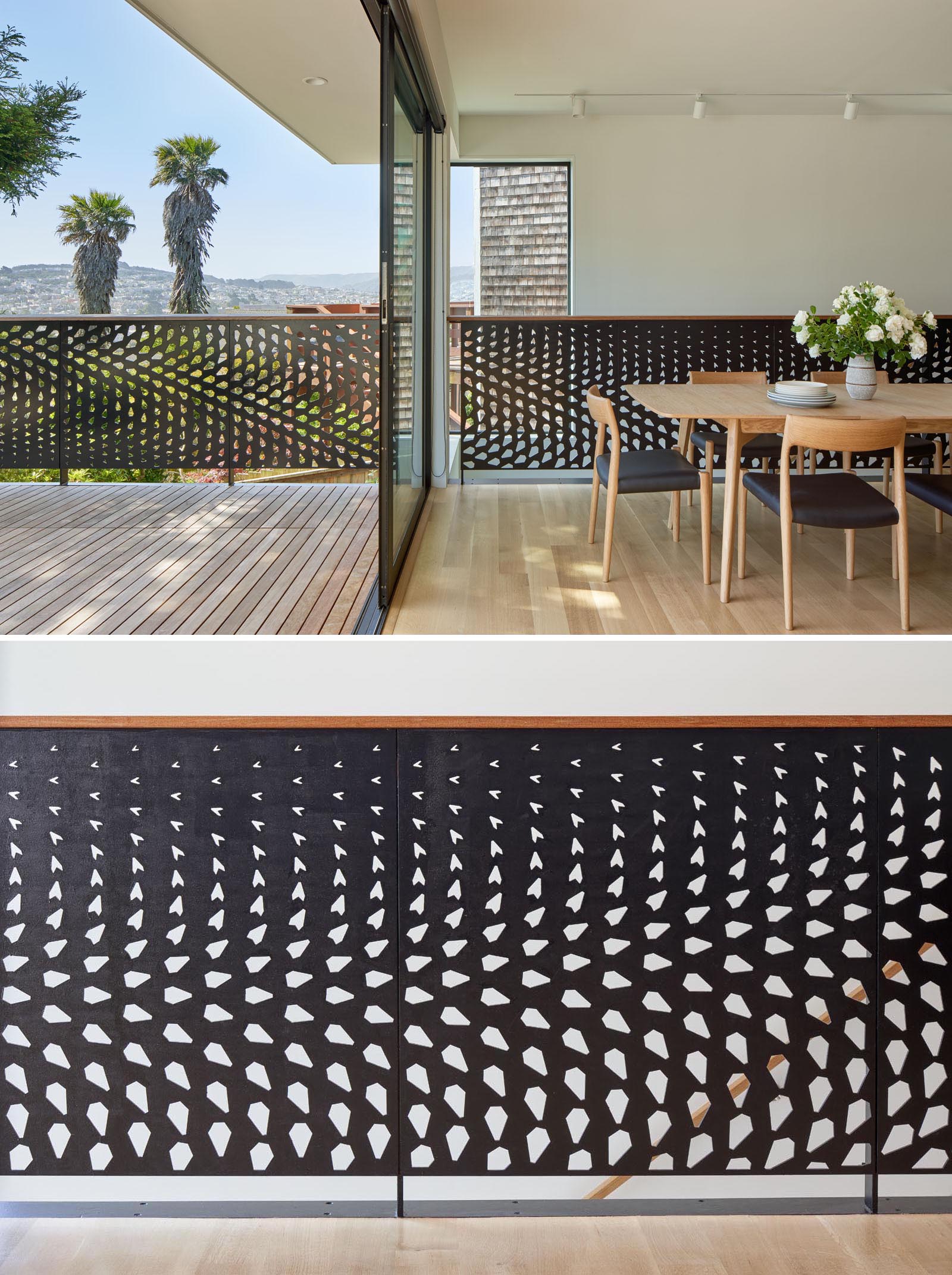 The dining room and living room of this remodeled home both open to a deck with seating and views. The metal guardrail design, which flows from the interior to the exterior is inspired by the huge conifer tree outside.