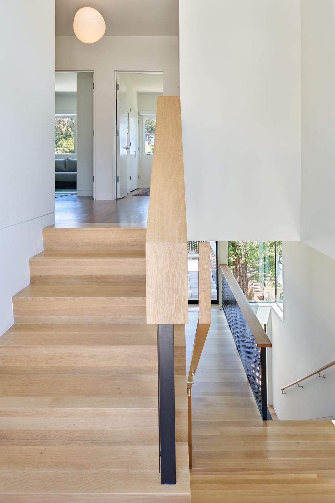 The wood stairs of a modern split-level home.
