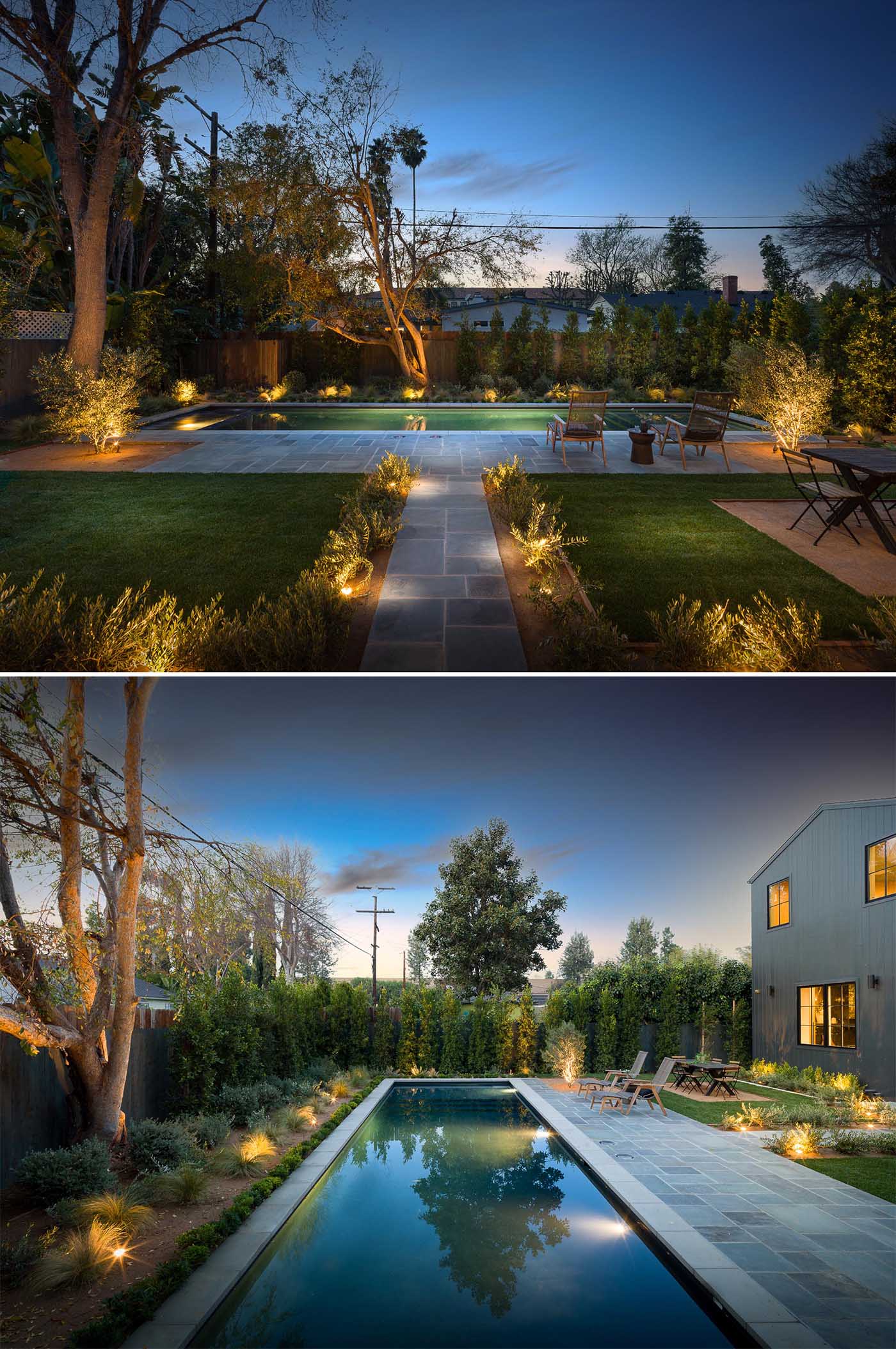 A landscaped backyard with a 50 foot swimming pool.