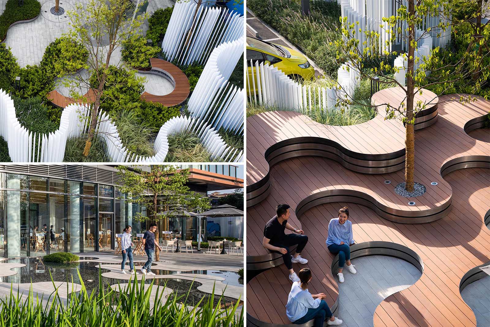 A landscaped park that includes curved tiered seating, water features, a vertical white strip fence, and outdoor lighting.