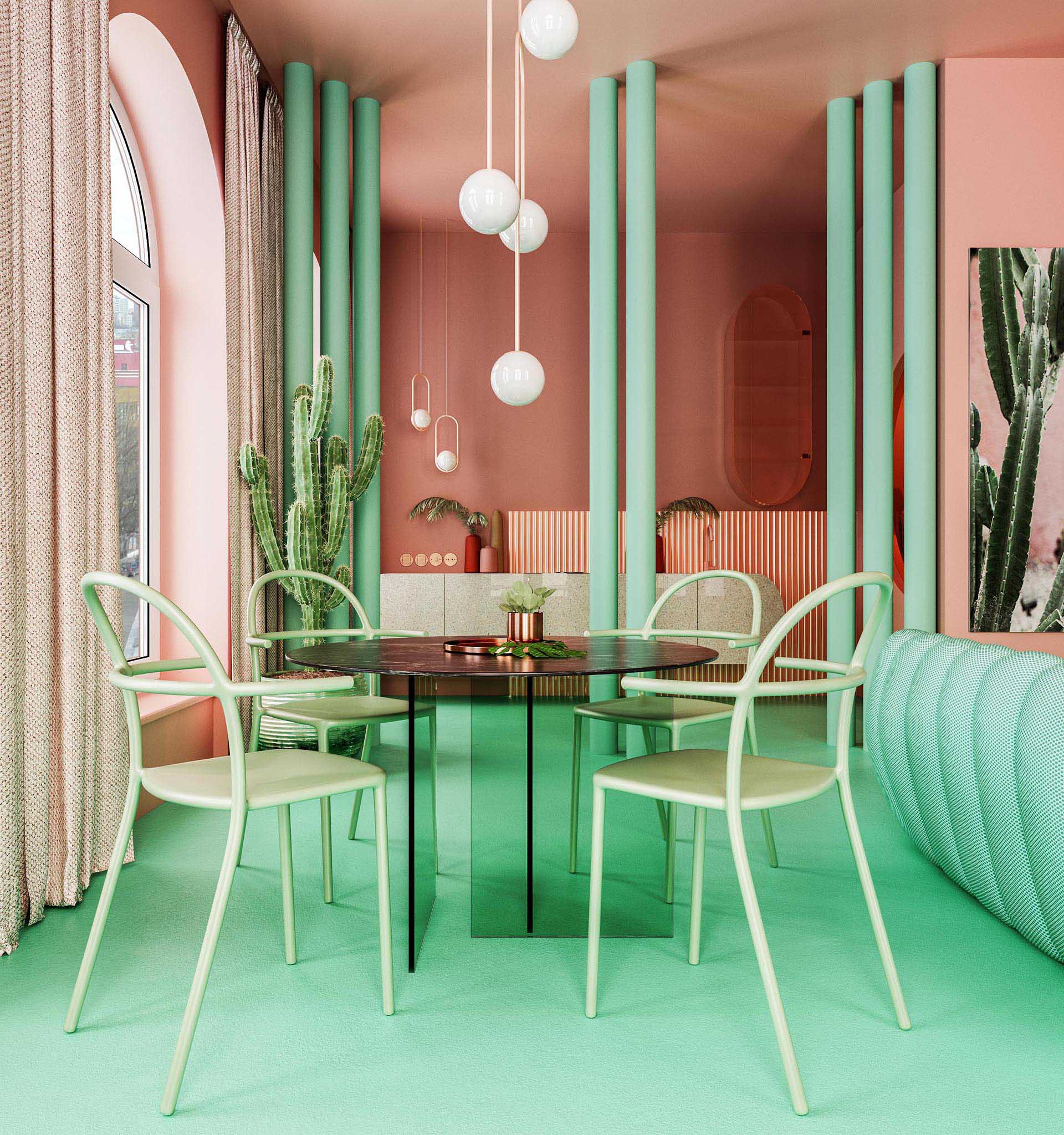 This pink and green dining area features a custom designed dining table with a marble top and glass base. Floor-to-ceiling curtains, green columns, and pendant lights draw the eye upwards to the high ceilings. 