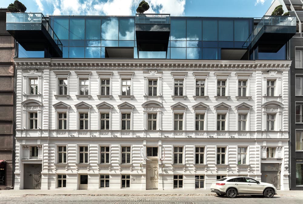 The apartment building in the historical centre of Riga, Latvia, comprises of the remaining 20th century Art Nouveau facade with a new volume added.