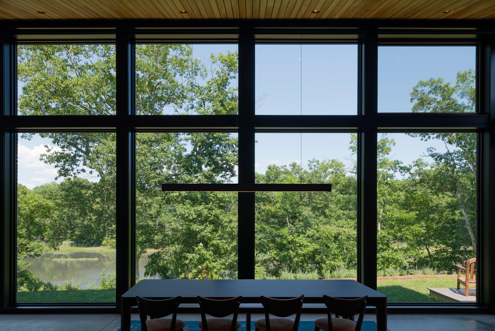 Floor to ceiling windows provide views of the marshland.